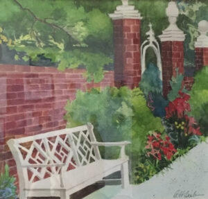 Park bench in front of brick wall